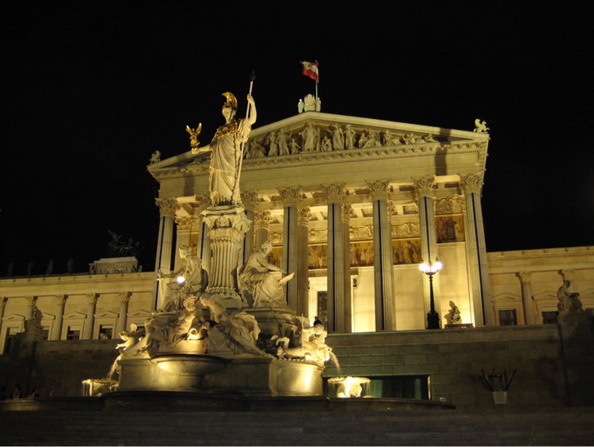 Austrian parliament building at night. Markus Bernet/ Wikimedia