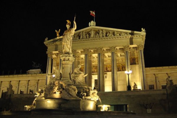 Austrian parliament building at night. Markus Bernet/ Wikimedia